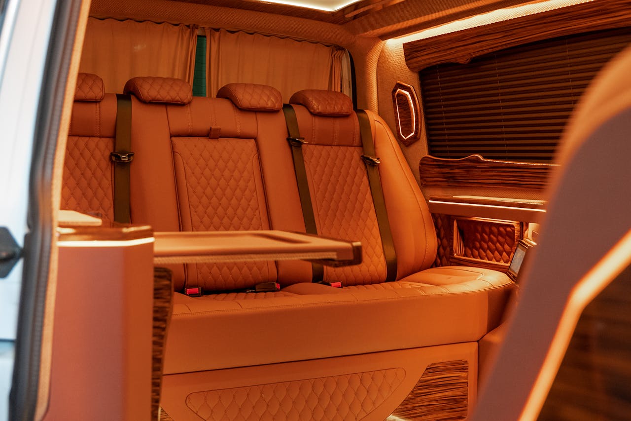 Elegant brown leather car interior showcasing luxury seats and modern design.