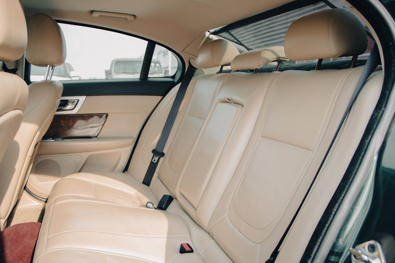 Explore the comfortable and elegant leather interior of a sedan car, showcasing premium craftsmanship.