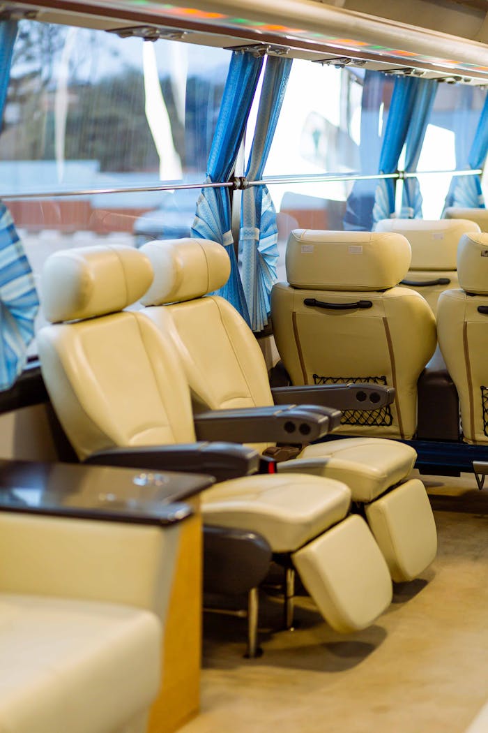 Spacious and comfortable seating arrangement in a high-end passenger bus, showcasing premium design.